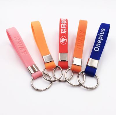 China Deboss logo and information silicone/soft PVC /Rubber material key chain and coin holder for sale