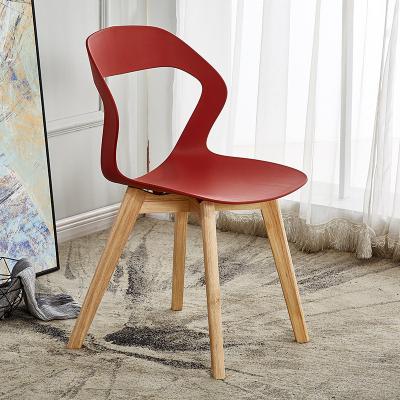 China Factory Wholesale Modern Nordic Household Furniture Simplicity Plastic Dining Chairs With Wooden Legs for sale