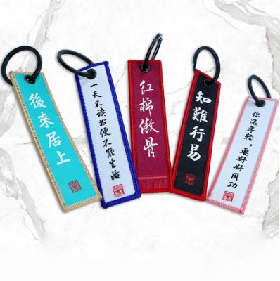 China Promotion Logo Key Tag Customized Gift Custom Embroidered Keychains for sale