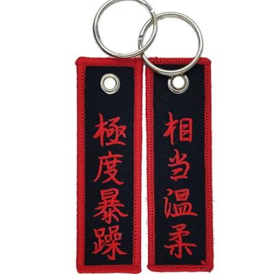 China Customized Promotion Gift Embroidery Key Chain Motorcycle Cloth Printed Embroidered Keychain Spray Tag for sale