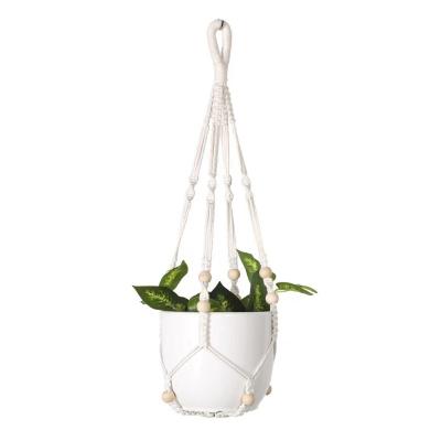 China Bohemian Hot Selling Handmade Arming Rope Basket For Plants Macrame Wall Basket Plant Pots for sale