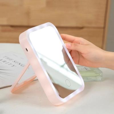 China LED Glow Makeup Mirror Touch Screen Lighted Dressing Table Mirror with Adjustable Usb Rechargeable Beauty Tool for sale