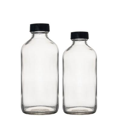 China Berlin Packaging Cosmetic Clear Bottles 32oz 16oz 1oz Juice Milk Boston Round Glass for sale