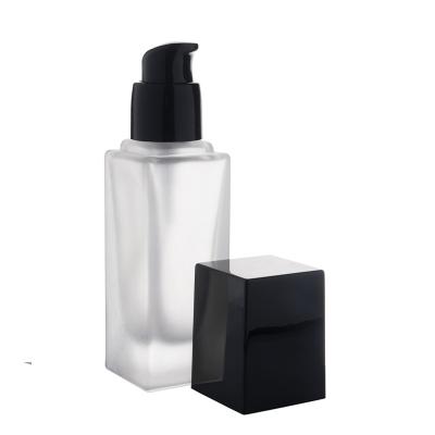 China Berlin Packaging Frosted Square Glass Cosmetic Bottles With Treatment Pump 1oz 2oz Black Square Spray Frosted Glass Bottle for sale