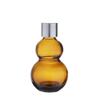 China Berlin Packaging Essential Oil Glass Cosmetic Bottle Gourd Shape 10ml 20ml 30ml Amber Essential Oil Bottle for sale