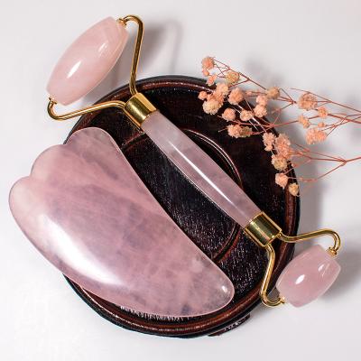 China Dual Rollers/Portable/Cool/Comfortable Natural Facial Massager Crystal Rose Quartz Stone Guasha Massage Tool With Box for sale