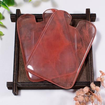 China Red Concave Shape Jade Facial Roller Guasha Gua Sha Bian Stone Face Massage Tool Natural Watermelon Face and Body Massager for sale