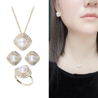 China Ethnic Fashion Geometry Design Cooper Gold Plated Jewelry Button Pearl Ring Earring Pendant Set For Women for sale