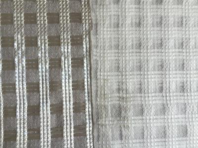 China Polyester / Fiberglass Geogrid Stitched Composite Geotextile With Nonwoven Geotextile for sale