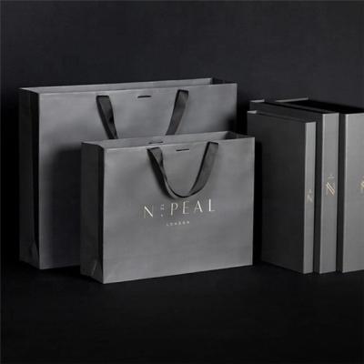 China Various Sizes Recycled Cheap Paper Bag Recycled Materials Fashion Handle Custom Gift With Your Logo for sale