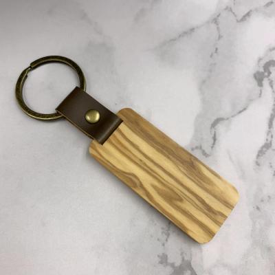 China Wooden Key Chain Wood Blank Handcrafted Wood Craft Key Chain Cheap Engaving Gift for sale