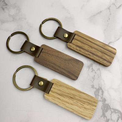 China Wood Laser Engrave Wood Blank Key Chain Keychains Handcrafted Simple Craft Wood Keepsake Key Ring Holder for sale