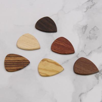 China Personalized Quality Guitar Pick White Engravable Wooden Guitar Pick for sale