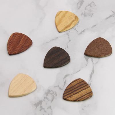 China Custom Solid Quality Guitar Pick White Engravable Wooden Guitar Pick for sale