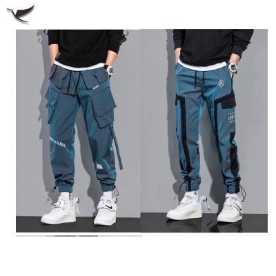 China Wholesale Mens Sweatpants Hip Hop Reflective Loose Pants Anti-Wrinkle Waterproof Casual Multi Pockets Man Cargo Pants for sale