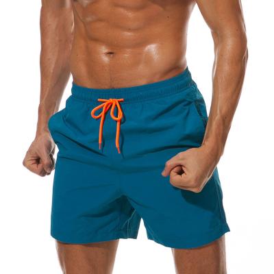 China QUICK DRY Mens Gym Shorts With Pockets Mens Swim Trunks Beach Quick Dry Shorts With Pockets for sale