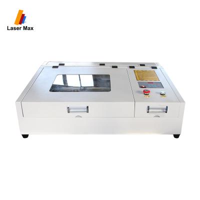 China Laser Engraving Mini CO2 50W CNC Laser Cutter Price China Laser Cutter Engraver Engraver Stamp Machine for sale