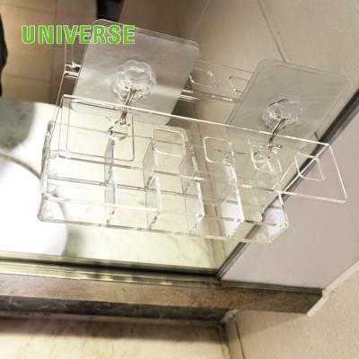 China UNIS handmade custom acrylic toiletry display rack display rack can be hung on the wall for sale