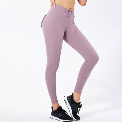 China New beautiful breathable hot fashion elastic sexy longitudinal section with pockets Nine point waist pants high fitness outdoor sports for sale