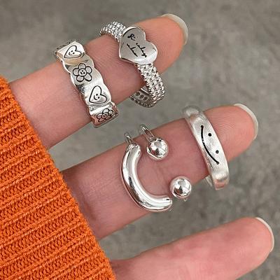 China CLASSIC Korean version of light luxury cold design high-end index finger ring happy smiling women's combination wear love face niche for sale