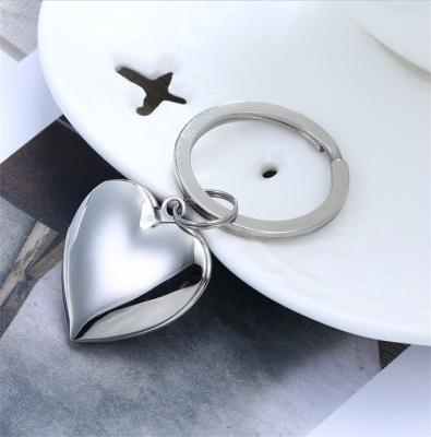 China Heart Round Rectangular Shiny Loket Metal Stainless Steel Jewelry Photo Box Key Chain Fishing Key Chain for sale