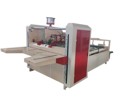 China Dongheng Food Folding Gluing Machine For Corrugated Cardboard Making Semi Automatic Feeding Folding Automatic Gluing Pressing for sale