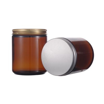 China Manufacturer 250g 100g Amber Candle Jar Face Eye Glass Body Cream Jar Cosmetic Bottles With Gold Rotating Aluminum Lid for sale