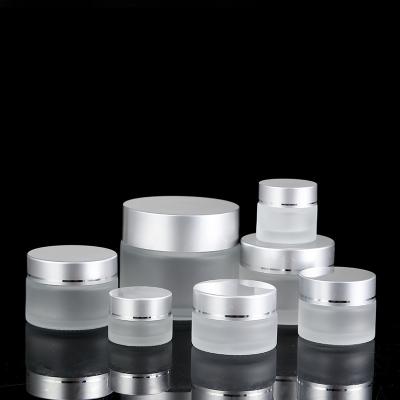 China 10g 15g 20g 30g 50g Small Color Cosmetics Container Luxury Frosted Glass Cream Jars With Screw Silver Cap for sale