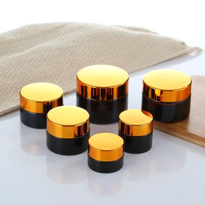 China Wholesale 10g 20g 30g 50g Shea Butter Amber Brown Cosmetic Glass Cream Cream Packaging Jars For Candles With Gold Top Lid for sale