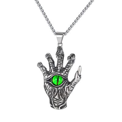 China TRENDY retro demon skull hip hop European and American heroic men's titanium steel hands green eyeball pendant necklace for sale