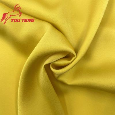 China Flame Retardant Soft Silky Hand Feel Recycled Polyester Fabric Stretch Satin SPH Yarn Fabric Certificated for sale