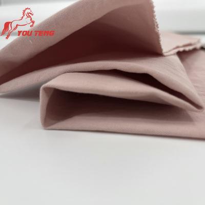 China YouTeng Sustainable 32S Washed Cotton Ply Twill Fabric Customized Plain Dyed 100% Pure Organic Cotton Soft Woven For Shirting Linen Fabric for sale