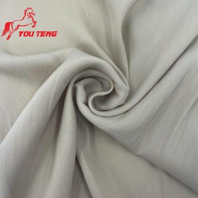 China Good Suede Hand Feel Sea Island Fire Retardant Filament Woven Ply 100% Polyester Cavalry Twill Fabric For Dress Shirt for sale