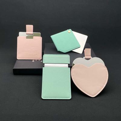 China Minimalist customized high-material leather irregular handheld pull-out makeup mirror for sale