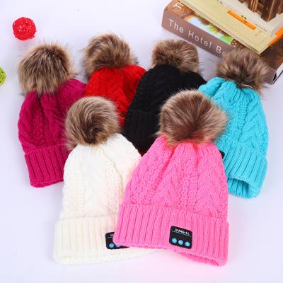 China JOINT Custom Acrylic Knitted Beanie With Pom Pom Tooth Beanie Cap Wireless Blue Hat With Earphone for sale