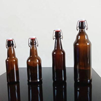 China Beverage Amber Glass Beer Bottles for home brewing with Flip Caps for sale