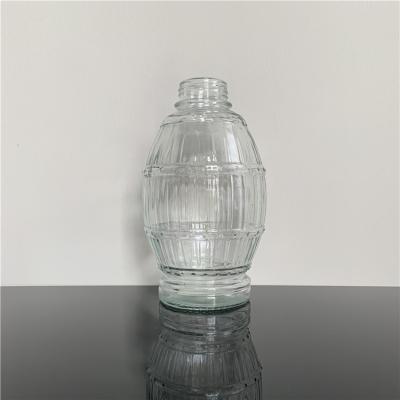 China Beverage barrel shaped glass bottle for alcoholic drinks and soft drinks 1000ml for sale