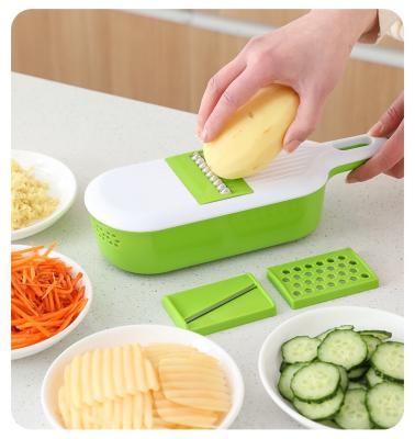 China Viable Multifunctional Plastic Plastic Slicer Manual Potato Peeler Slicer Garlic Peeler Garlic Grind Carrot Onion Grater for sale