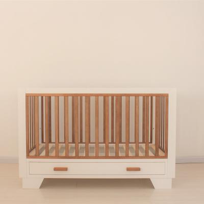 China Modern New Design Wooden Baby Cradle With Drawer for sale