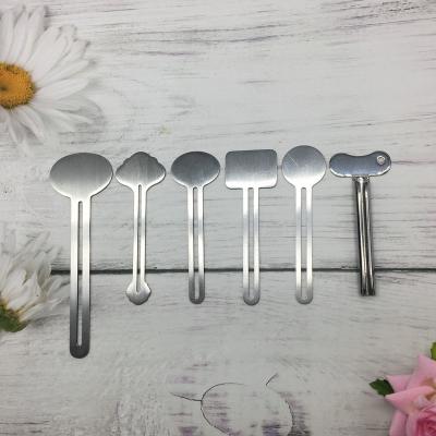 China Viable Metal Tube Squeezer Roller Key Toothpaste Squeezer Stainless Steel Toothpaste Roller Tube for sale