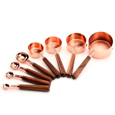 China Sustainable 8 Piece Copper Plated Measuring Cups And Dosers Set With Wooden Handle for sale