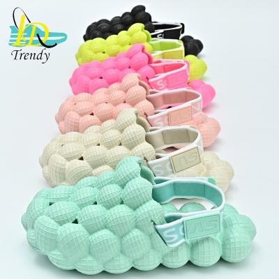 China 2023 New Arrivals Summer Beach Home Golf Ball Cushioning Message Slippers Slides Eva Lady Men Kids Bubble Slides With Charms Strap for sale