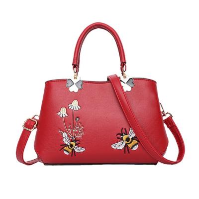 China Latest 2022 new waterproof blue color flower leather brand designers women full handbags with embroidery for sale