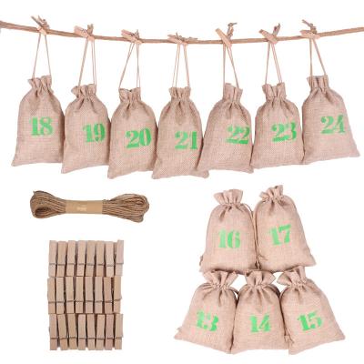 China Wooden Jute Christmas Drawstring Bag 24pcs Tags Advent Calendar Countdown Gift Bag Set for sale