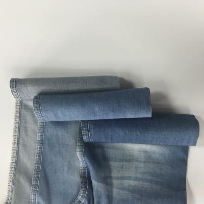 China Breathable 5oz 100%cotton denim fabric +grey desizing dark blue jeans fabric for menswear for sale