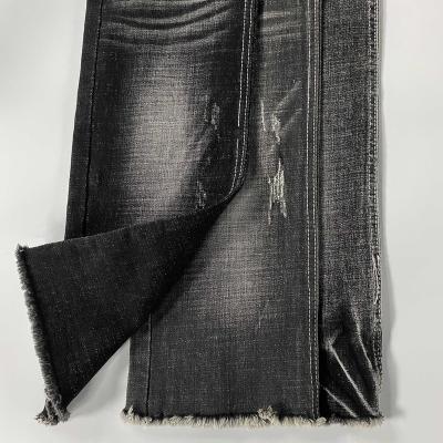 China Breathable cool denim fabrics for women jeans with light warp roving denim in dark blue color for sale