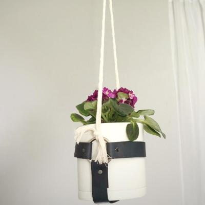 China Indoor Small European Wall Plant Hanger Garden Rope Plant Flowerpot Hanger Minimalist Leather Plant Hangers for sale