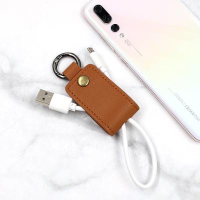 China New Brown Cable Holder Clips Durable Leather PU Cable Holder Wire Organizer USB Winder Pockets Chain Rings for sale