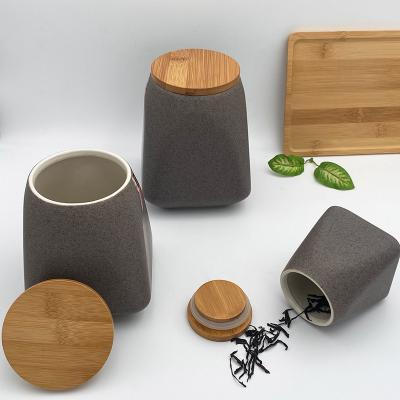 China Modern Design Sustainable Tea Coffee Sugar Ceramic Storage Canister For Kitchen Countertop With Bamboo Lid for sale