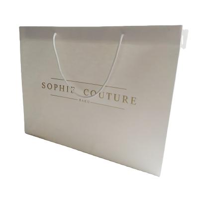 China Qingdao Disposable White Luxury Custom Shopping Paper Bag With Your Own Logo And Handle for sale